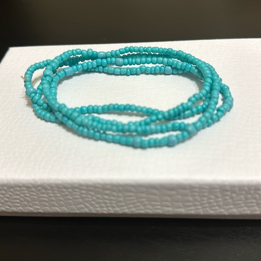 Blue waist beads. Stretchy. Brand new. About 32 inches